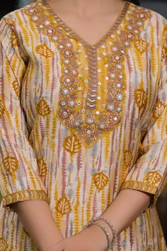 Beautiful jaipuri a yellow and white printed indian kurta set with a matching dupatta and pants