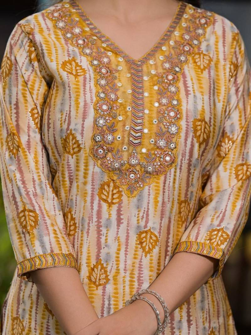 Beautiful jaipuri a yellow and white printed indian kurta set with a matching dupatta and pants.