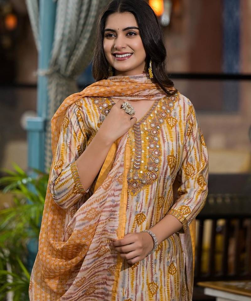 Beautiful jaipuri a yellow and white printed indian kurta set with a matching dupatta and pants.