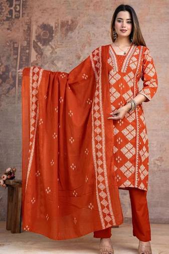 Beautiful jaipuri a rust orange cotton kurta, pant, and dupatta set with floral applique designs and orange piping.