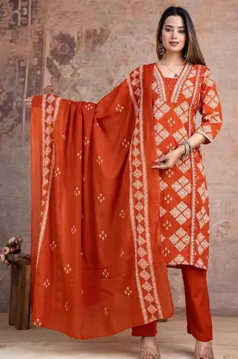 Beautiful jaipuri a rust orange cotton kurta, pant, and dupatta set with floral applique designs and orange piping.