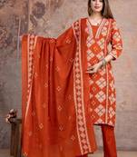 Beautiful jaipuri a rust orange cotton kurta, pant, and dupatta set with floral applique designs and orange piping.
