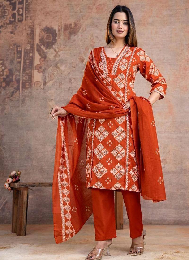 Beautiful jaipuri a rust orange cotton kurta, pant, and dupatta set with floral applique designs and orange piping.