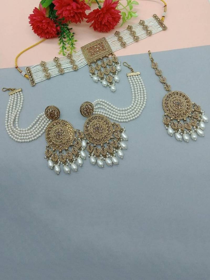 Traditional ethnic antique gold-plated pearl bridal choker set with earrings, maang tikka