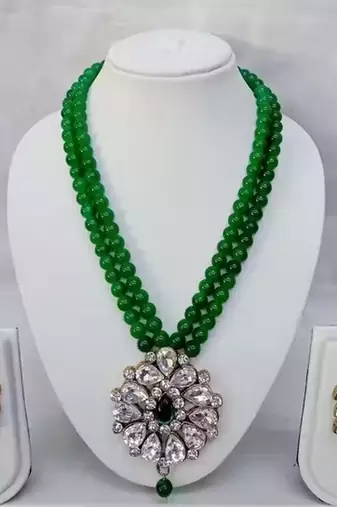 Traditional  handcrafted ethnic green beaded  necklace set  with gold-plated finish &  studded stones  