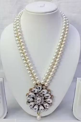 Traditional  handcrafted ethnicwhite beaded  necklace set  with gold-plated finish &  studded stones  