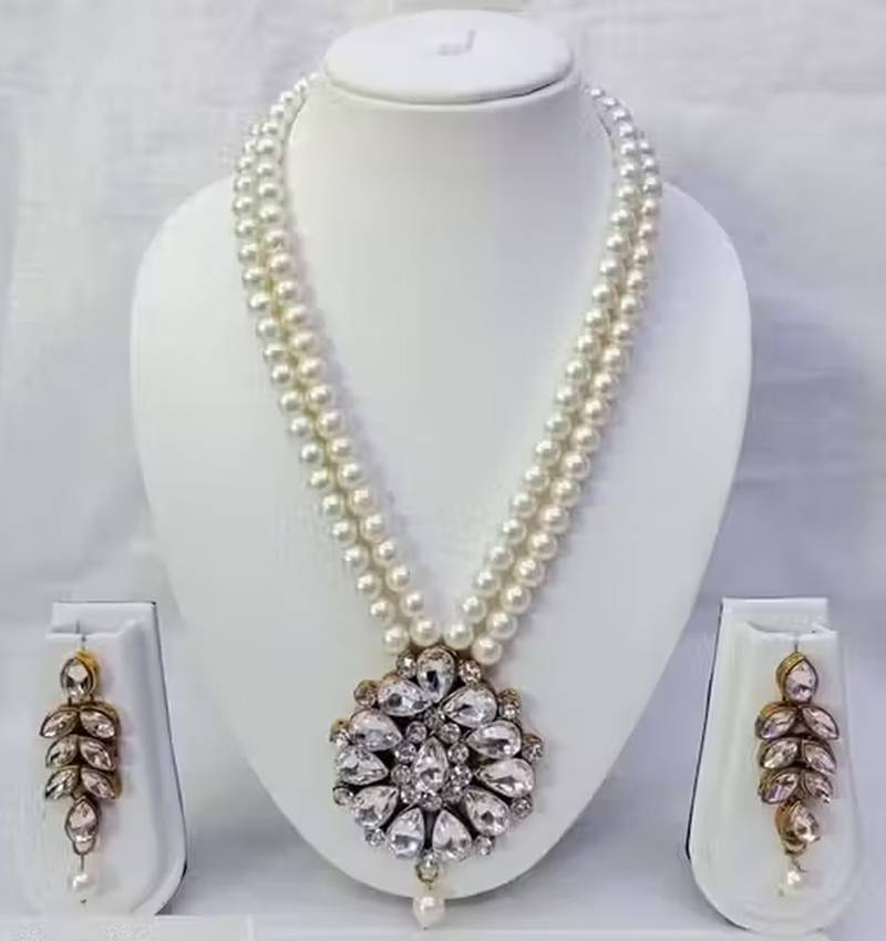 Traditional  handcrafted ethnicwhite beaded  necklace set  with gold-plated finish &  studded stones  