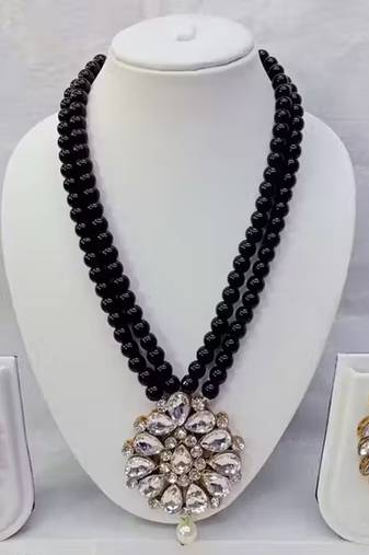 Traditional  handcrafted ethnic black beaded  necklace set  with gold-plated finish &  studded stones  