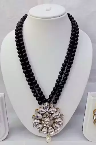 Traditional handcrafted ethnic black beaded necklace set with gold-plated finish & studded stones 