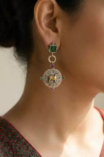 Green color oxidised earrings designed in dual-tone finish bringing refined festive sophistication