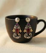 Red color oxidised earrings showcasing vibrant dual-tone shine ideal for festive traditional styling