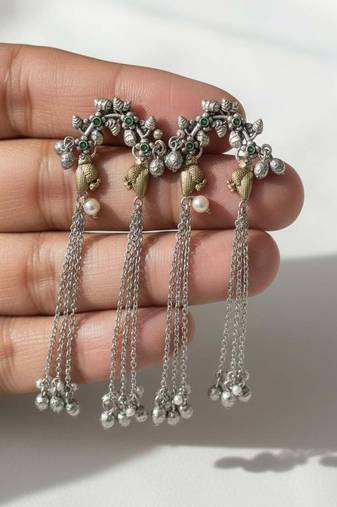 Green color oxidised earrings crafted with dual-tone finish enhancing timeless ethnic sophistication