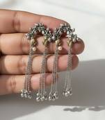 Green color oxidised earrings crafted with dual-tone finish enhancing timeless ethnic sophistication