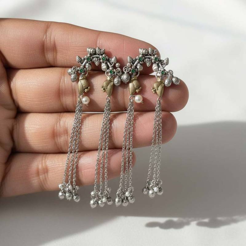 Green color oxidised earrings crafted with dual-tone finish enhancing timeless ethnic sophistication