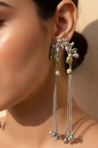 Rani & green color oxidised earrings highlighting contrasting dual-tone hues for festive grandeur