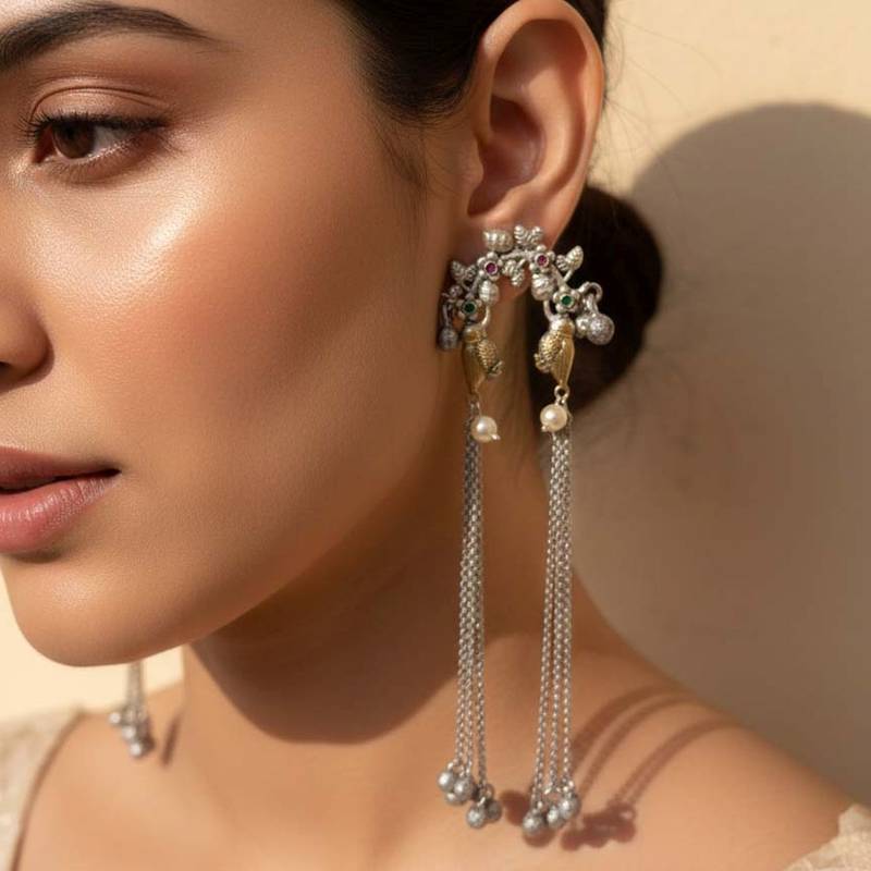 Rani & green color oxidised earrings highlighting contrasting dual-tone hues for festive grandeur