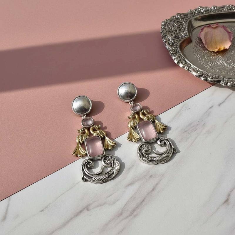 Light pink color oxidised earrings featuring delicate dual-tone craftsmanship for charming ethnic appeal