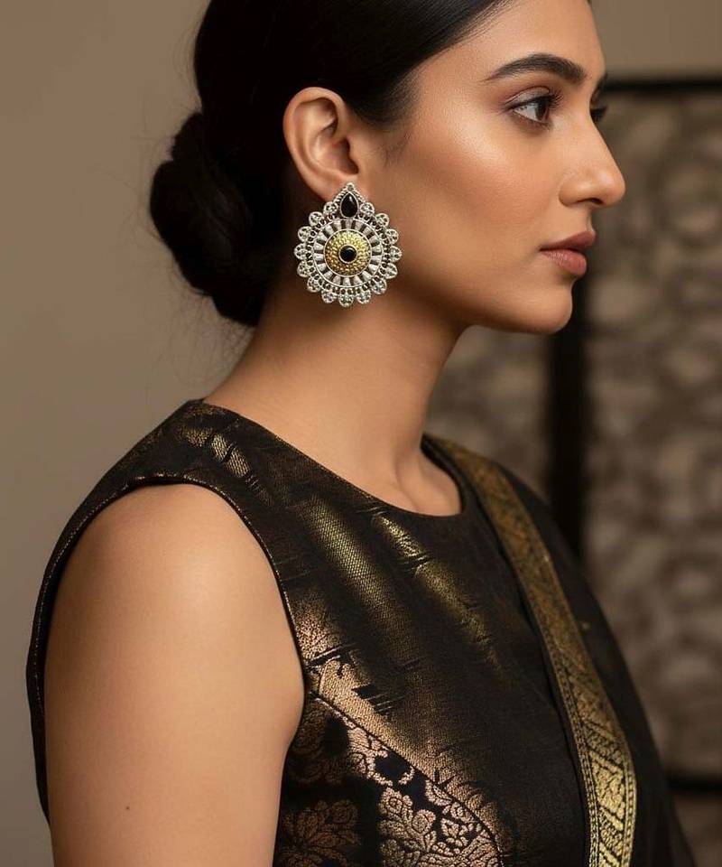 Black color oxidised earrings created with expressive dual-tone depth for strong cultural styling