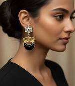 Black color oxidised earrings featuring detailed dual-tone metalwork ideal for striking ethnic fashion
