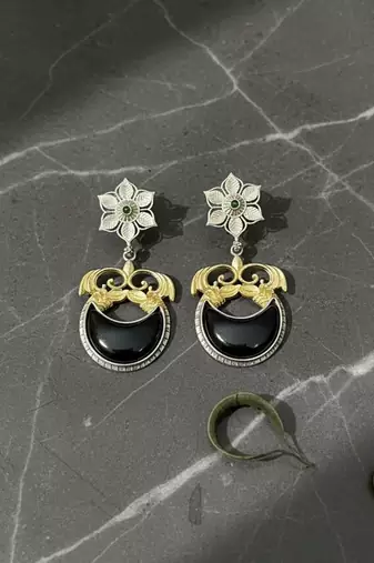 Black color oxidised earrings featuring detailed dual-tone metalwork ideal for striking ethnic fashion