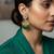 Green color oxidised earrings embodying dual-tone beauty perfect for enhancing festive appearances