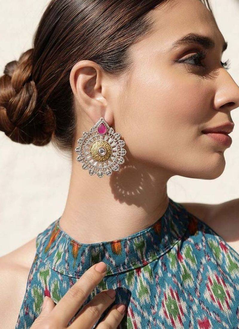 Rani color oxidised earrings made with dual-tone finish ideal for elegant ethnic celebrations