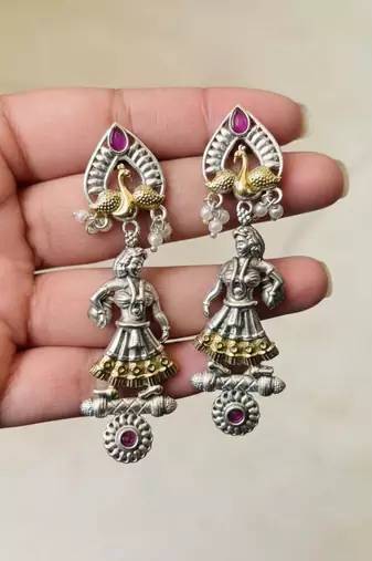 Rani color oxidised earrings featuring beautiful dual-tone patterns suited for festive celebrations