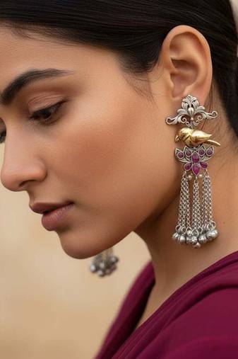 Rani color oxidised earrings crafted in dual-tone shades to bring striking traditional elegance