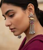 Rani color oxidised earrings crafted in dual-tone shades to bring striking traditional elegance