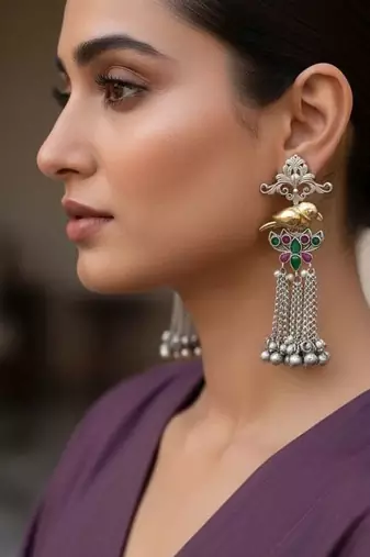 Rani & green color oxidised earrings offering dual-tone contrast ideal for bold cultural fashion