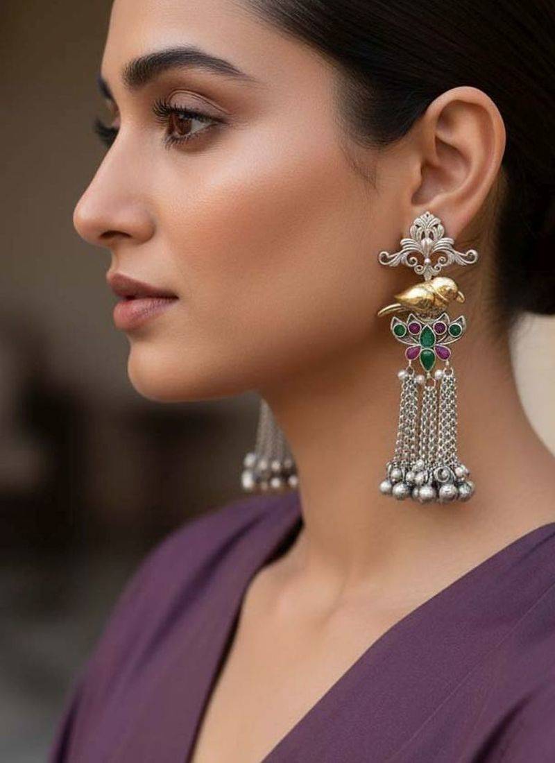 Rani & green color oxidised earrings offering dual-tone contrast ideal for bold cultural fashion