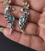 Multi color oxidised earrings blended with artistic dual-tone finishes for expressive festive styling