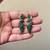Green color oxidised earrings styled with dual-tone textures to enrich festive ethnic clothing