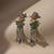 Green color oxidised earrings highlighting dual-tone craftsmanship perfect for festive ethnic moments