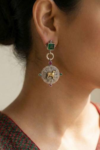 Green color oxidised earrings designed in dual-tone finish bringing refined festive sophistication