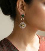 Green color oxidised earrings designed in dual-tone finish bringing refined festive sophistication