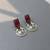 Maroon color oxidised earrings offering beautiful dual-tone accents ideal for ethnic statement looks