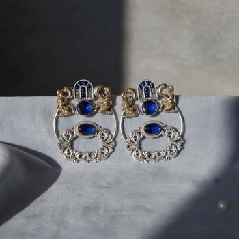 Blue color oxidised earrings designed with stunning dual-tone detailing for bold festive fashion 1