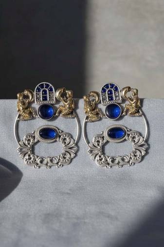 Blue color oxidised earrings designed with stunning dual-tone detailing for bold festive fashion