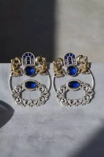 Blue color oxidised earrings designed with stunning dual-tone detailing for bold festive fashion