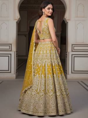 yellow zari work soft net lehenga set choli with dupatta 4
