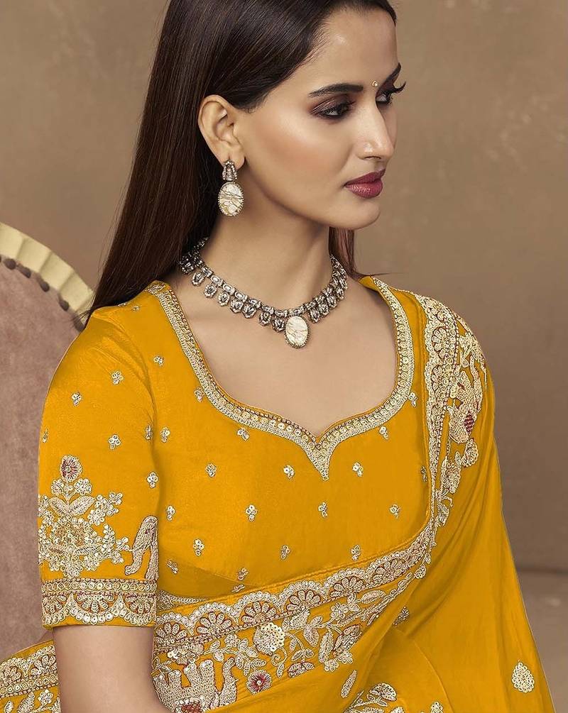 Yellow embroidered pramium satin saree with designer blouse fabric