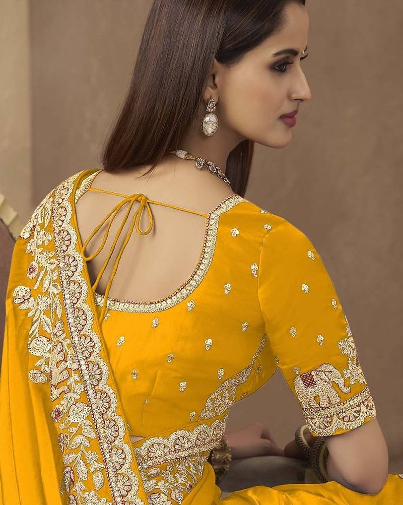 Yellow embroidered pramium satin saree with designer blouse fabric