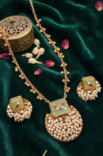 Gold finish pendant necklace set with kundan polki and ruby stones