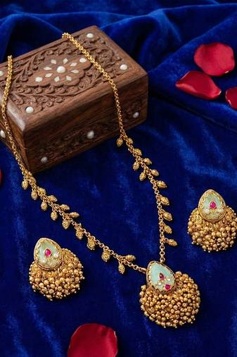 Temple pendant set in antique gold finish