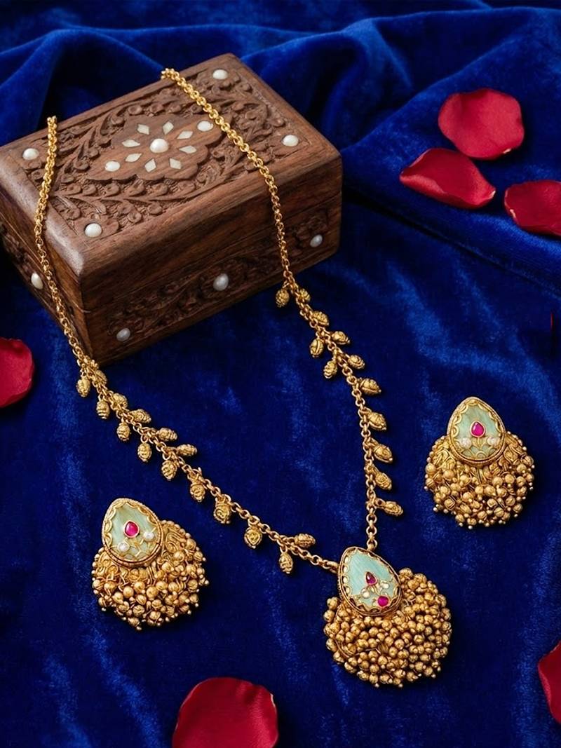 Temple pendant set in antique gold finish