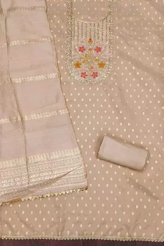 Beige woven shimmer churidar dress-materials