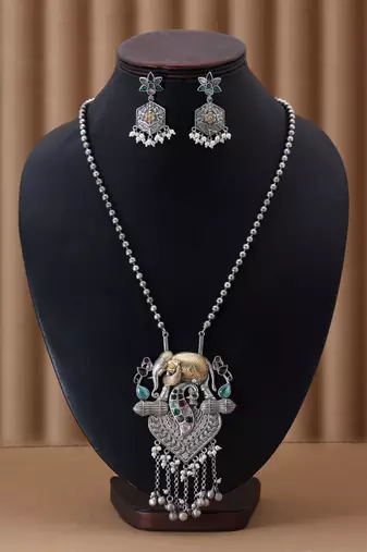 Multi color dual tone oxidised necklace set featuring vibrant designs for festive traditional styling