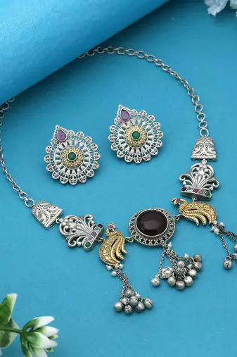 Multi color dual tone oxidised necklace set enhanced with artistic motifs for timeless ethnic charm