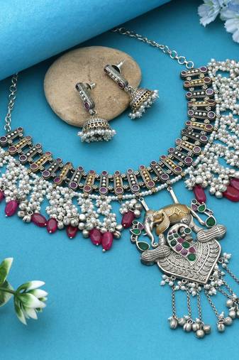 Rani & green color dual tone oxidised necklace set offering regal tones with ornate craftsmanship